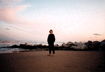 Jasmine standing on beach